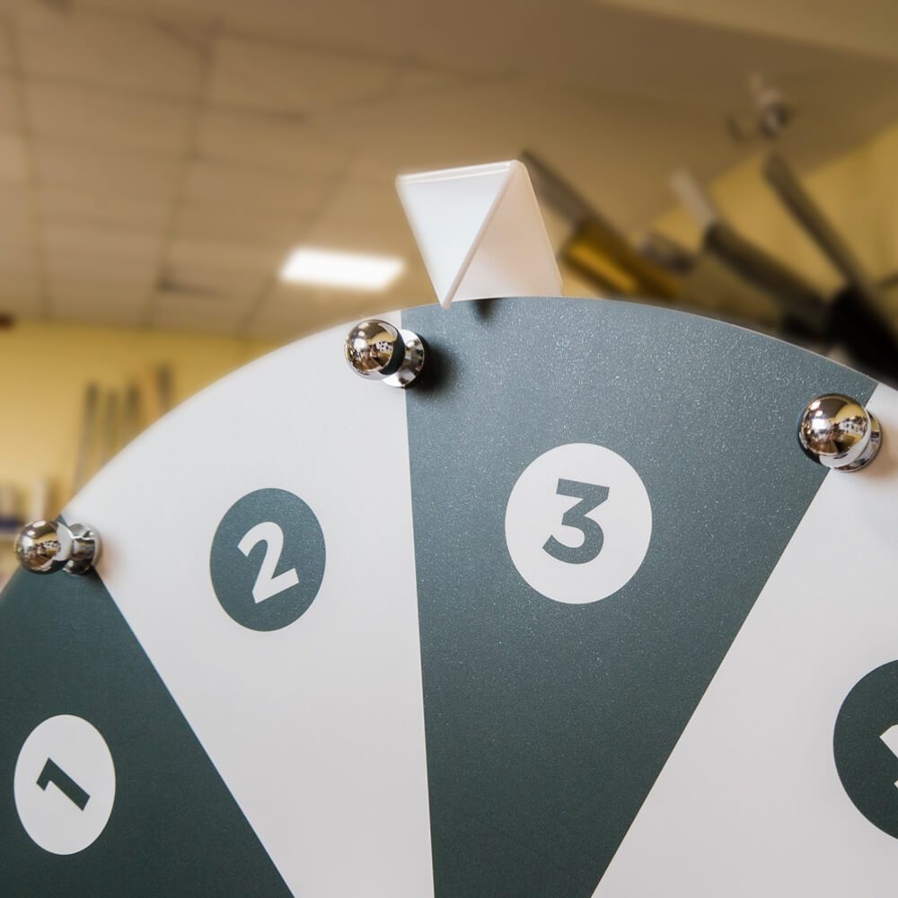 Close-up of numbered black and white prize wheel sections